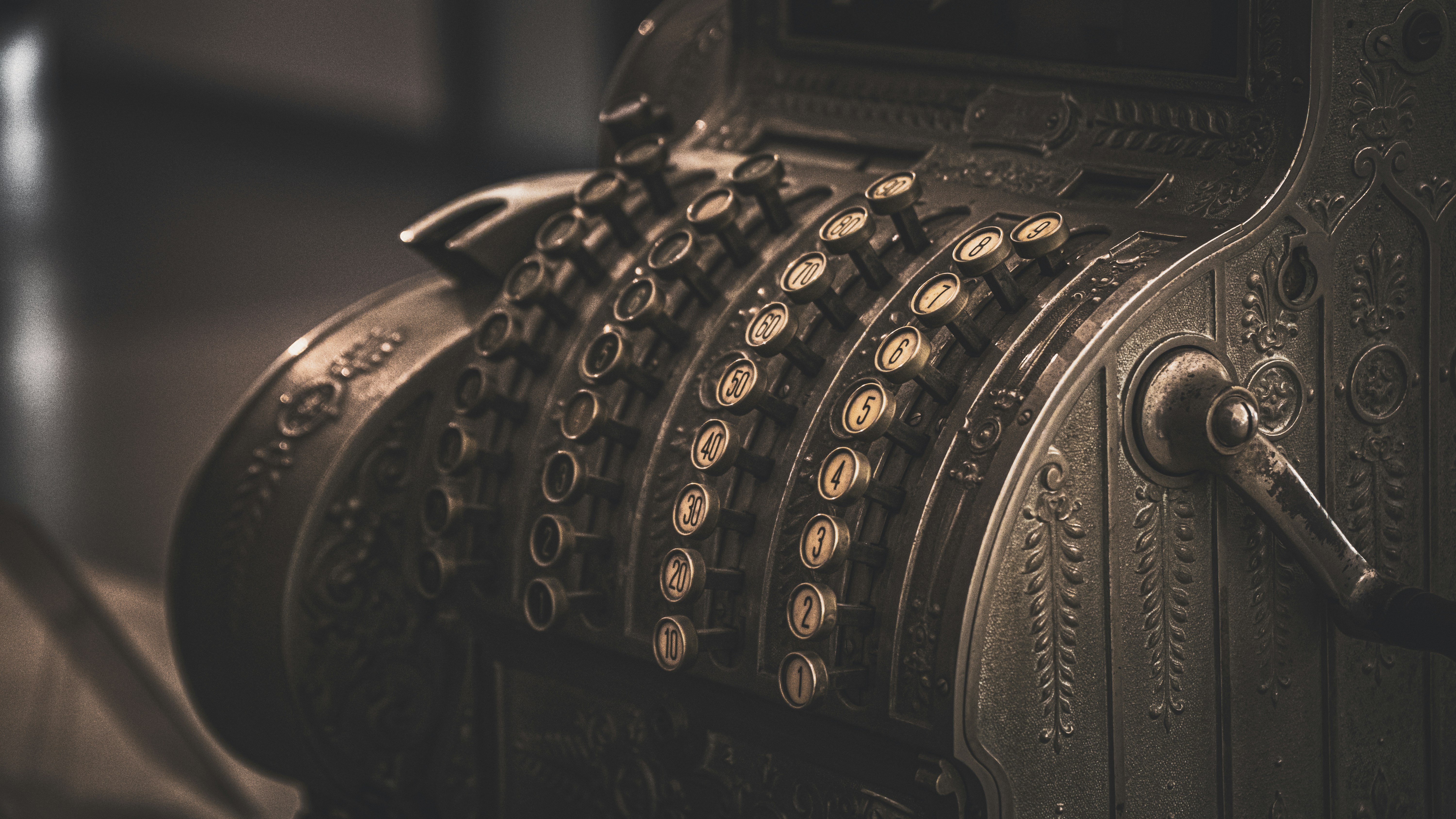 Antique cash register representing the cash discount program
