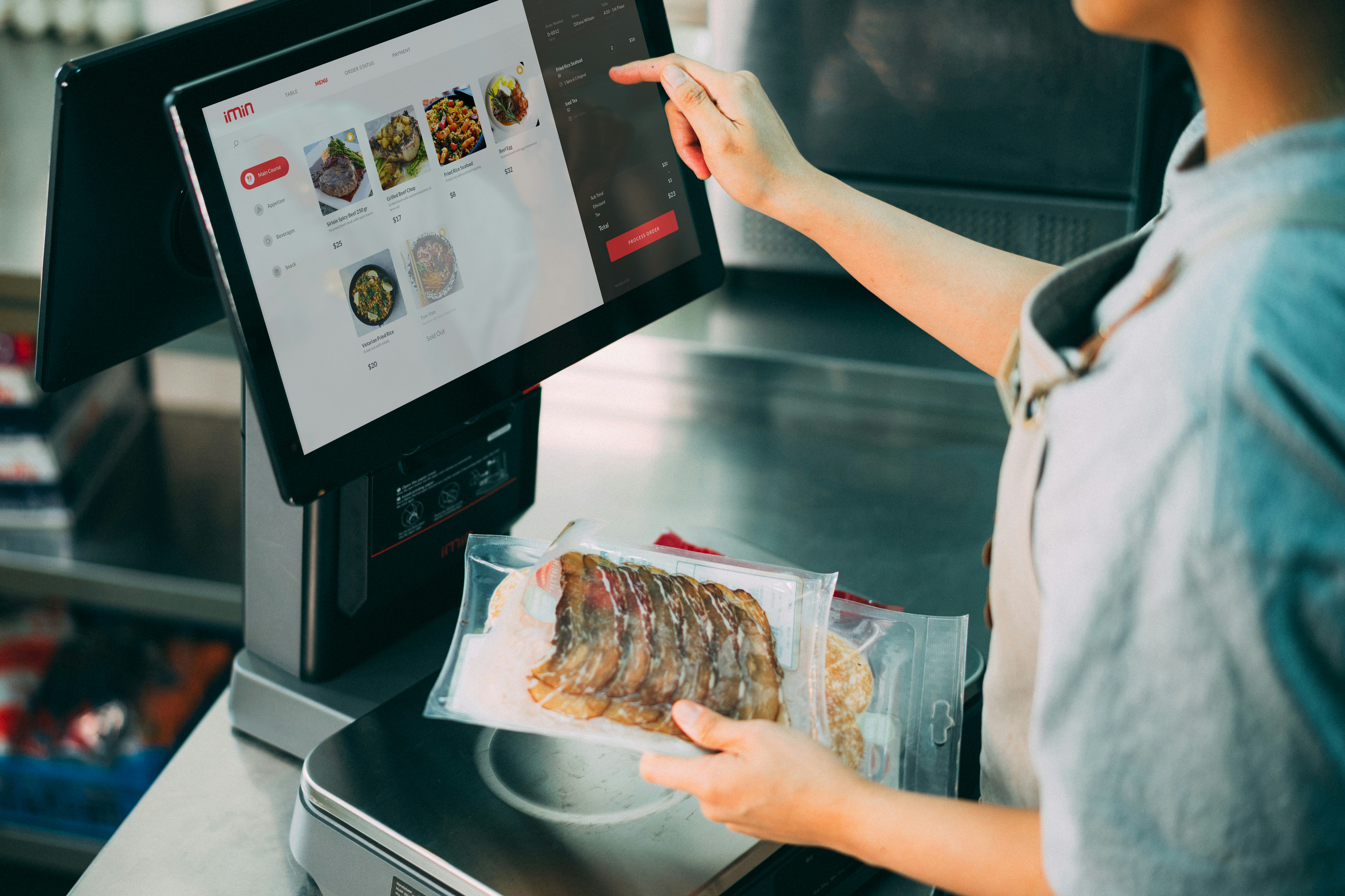 Restaurant staff using a Clover POS system